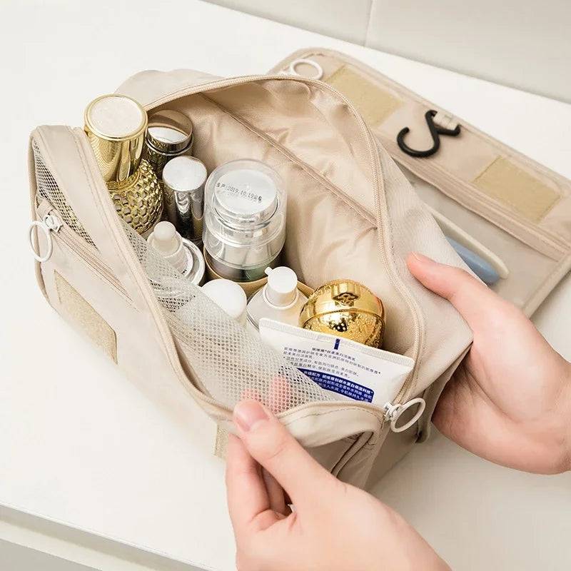 Spacious foldable makeup bag filled with skincare and cosmetic products. Durable travel toiletry bag for organized personal care storage.