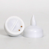 Bottom and side view of waterproof LED floating candle showing battery compartment and contact points; safe flameless lighting option.